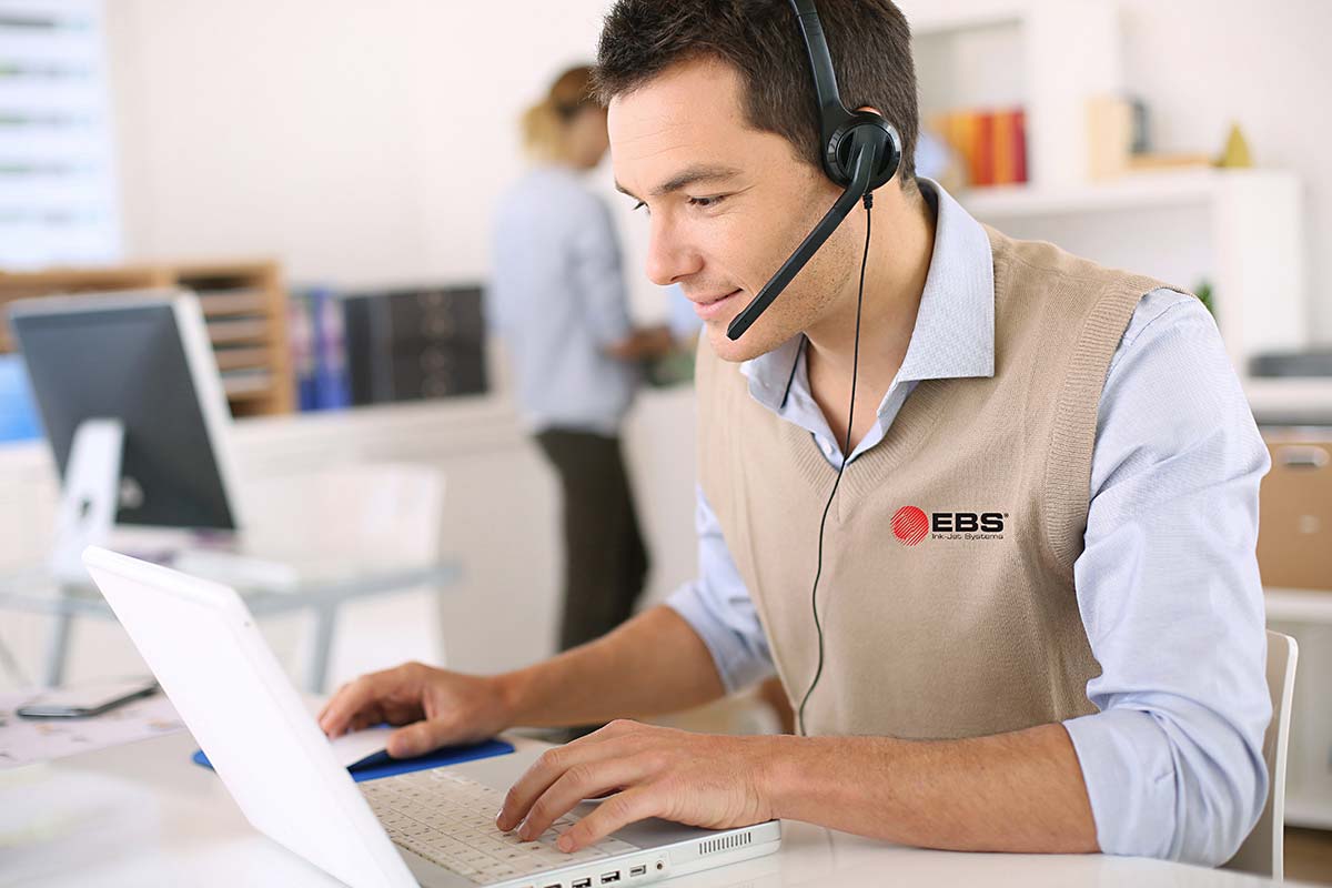 photo of a business person with a logo on their vest