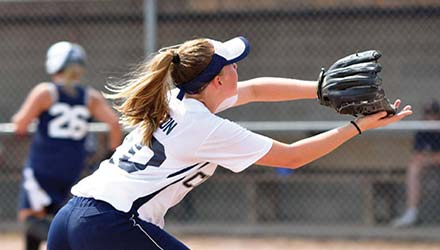 photo of a girl catching a softball