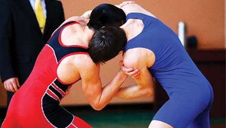 photo of two young men wrestling
